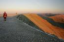 205-0601 Walker Approaching the Summit of Helvellyn at Dawn.  Lake District, Cumbria